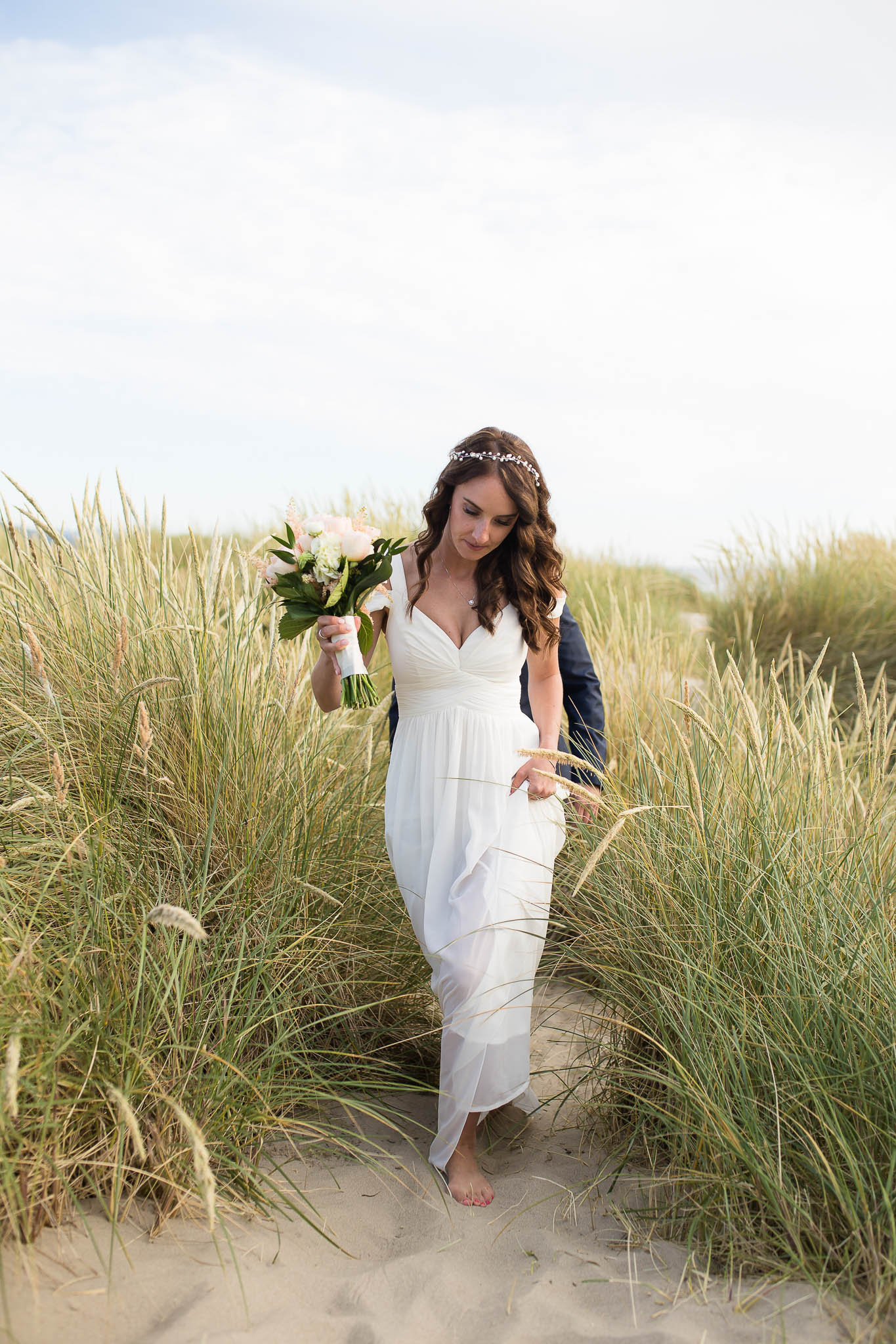 Oregon Coast wedding elopement near Cannon Beach in the seagrass at sunset